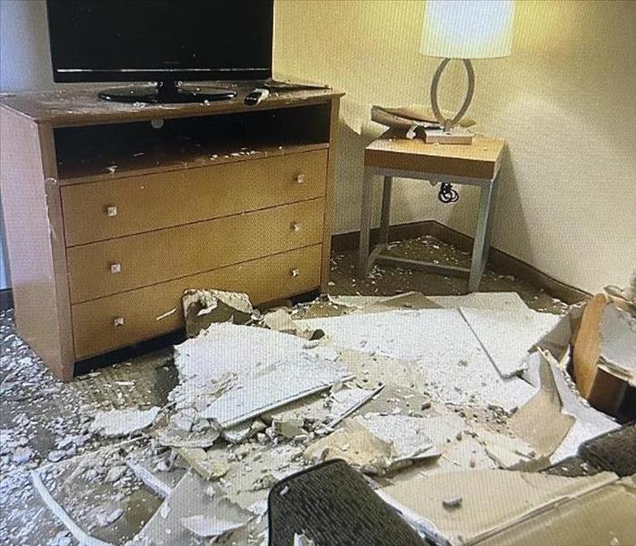Ceiling collapses in a hotel room after a frozen pipe bursts 
