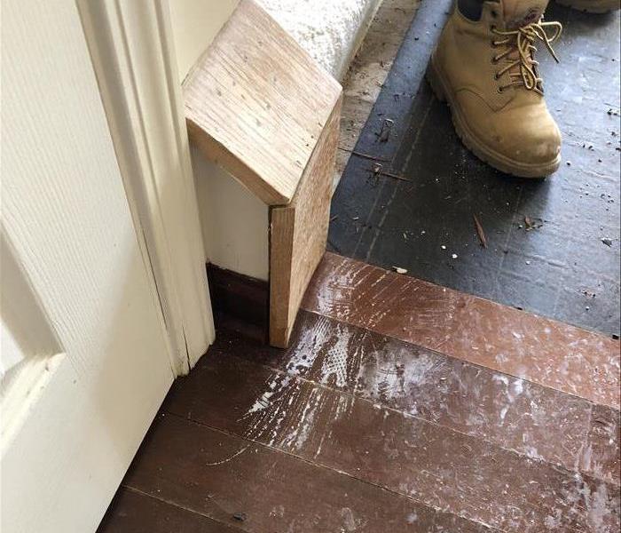 Hardwood floor warping due to recent water damage